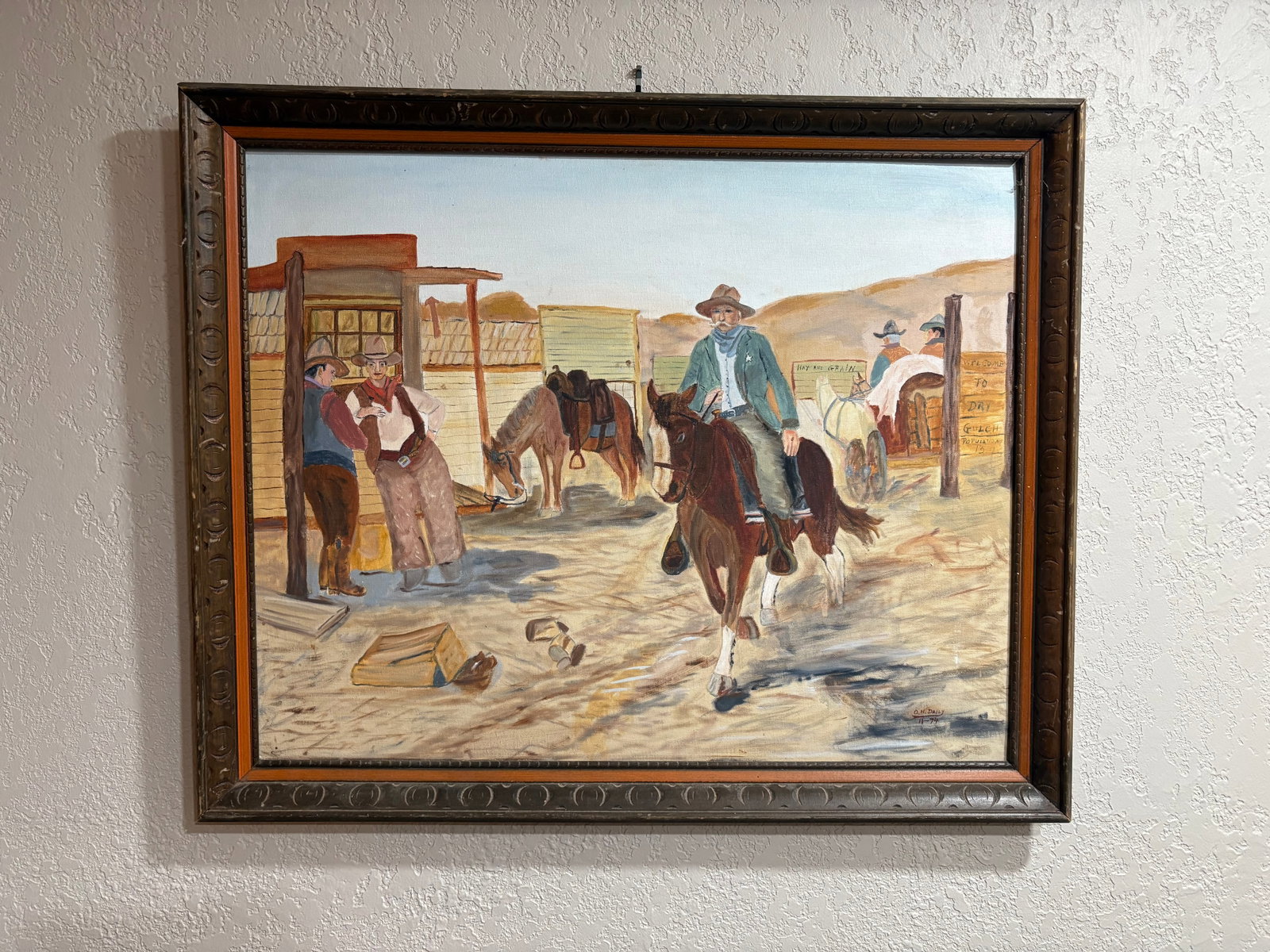 Vtg Folk Art/Amateur Framed Western Scene Oil Painting: A vintage folk art/amateur Western scene oil painting in a carved wooden frame, hand-signed, and dated November 1977. The piece shares thematic similarities with classic 20th-century Western illustrat