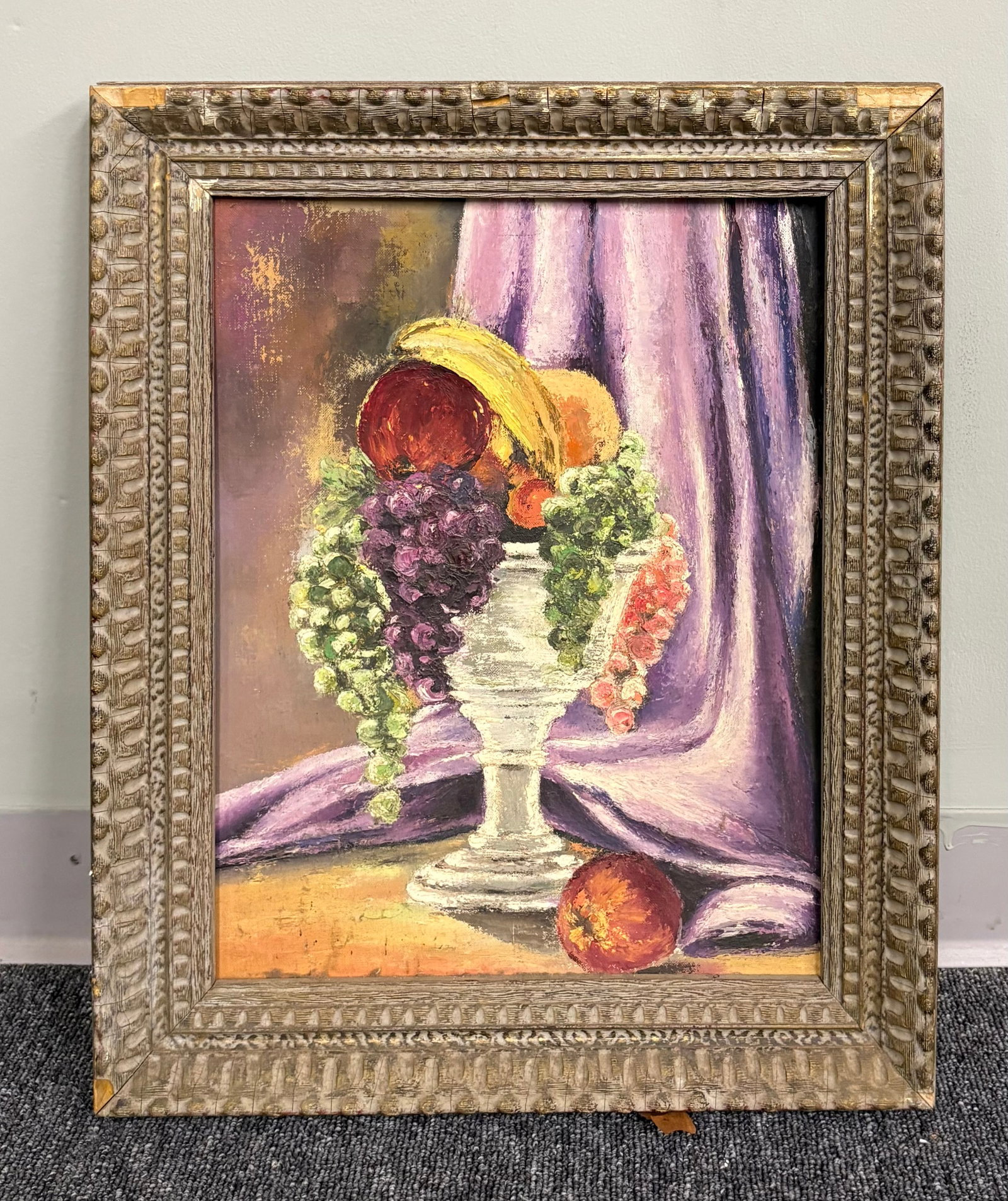 Vtg Late 20th Century Original Fruit Basket Still Life Framed Painting - 18 1/2" x 22": This is an original fruit still life painting beautifully housed in a distinctive, deeply textured frame. A classic, rich assortment of fruits—including prominent bunches of green and purple grapes,