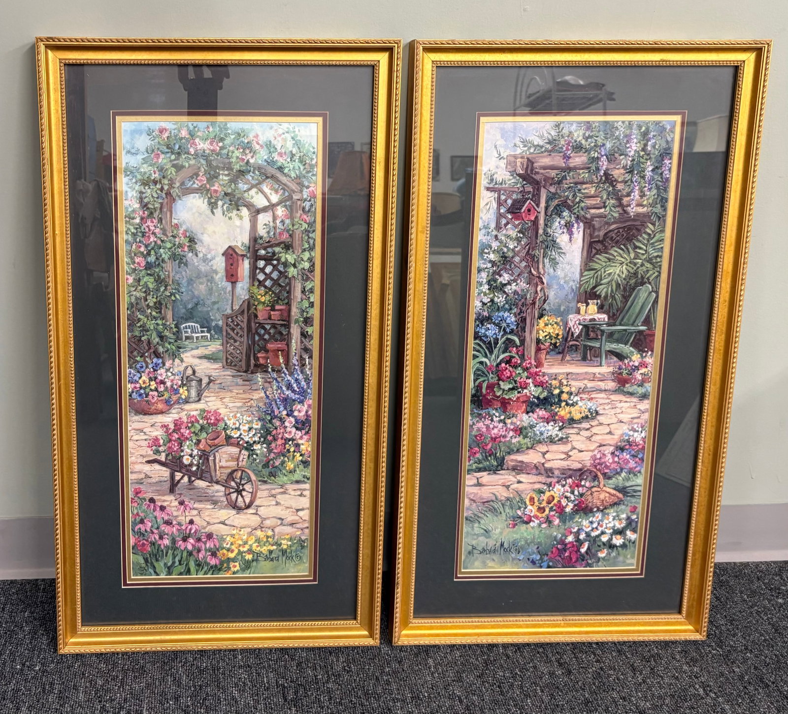 Vtg (80s/90s) Pair of Barbara Mock Art Prints, "The Potting Bench" & "Garden Hideaway" - 17" x 32": A pair of vintage framed art prints titled "The Potting Bench" and "Garden Hideaway" by artist Barbara Mock. These romantic, impressionistic garden scenes were famously distributed during the 1980s an