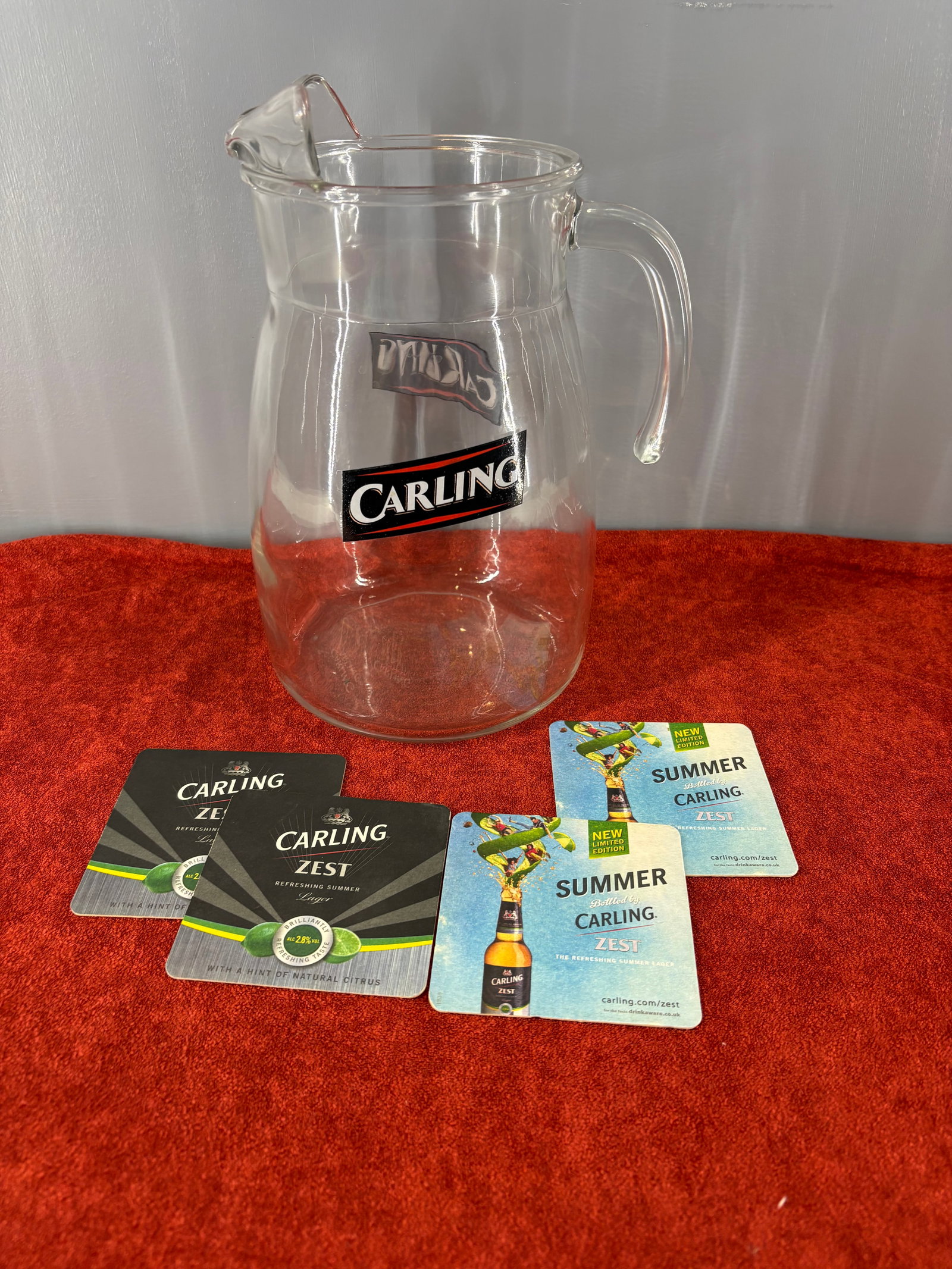 Vtg Carling Heavy-Duty Commercial Beer Pitcher & Matching Coasters: Vintage collection of Carling beer breweriana which includes...1). Carling 4-Pint Glass Beer Pitcher - A heavy-duty, commercial-grade clear glass jug featuring the prominent black and red Carling logo