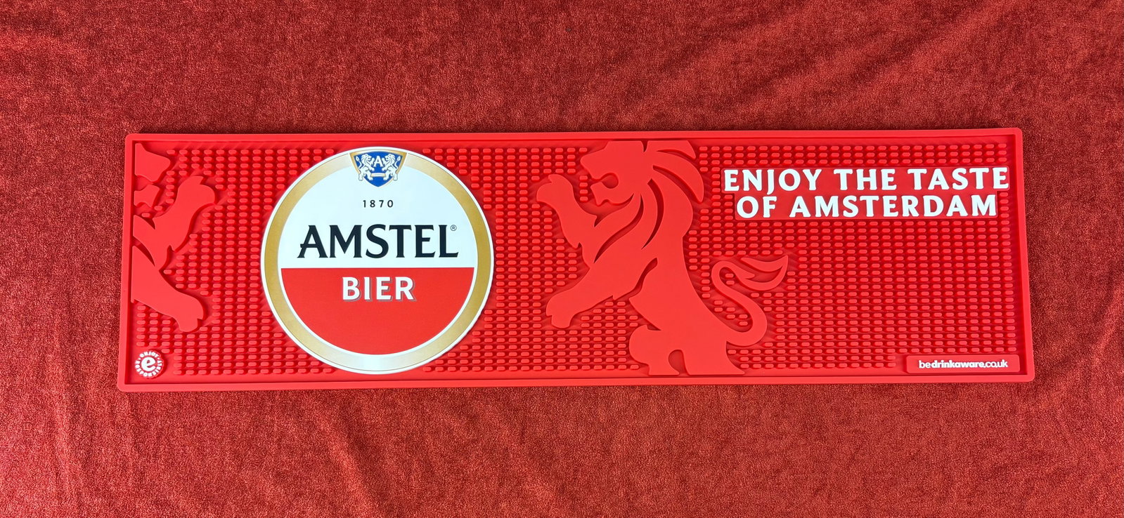 (British) Amstel Beer Heavy-Duty Rubber Bar Runner/Mat: Official Amstel Bier heavy-duty rubber bar mat, a standard commercial runner used to catch spills, protect bar surfaces, and drain glassware. It's emblazoned with the iconic Amstel Brewery logo, the f