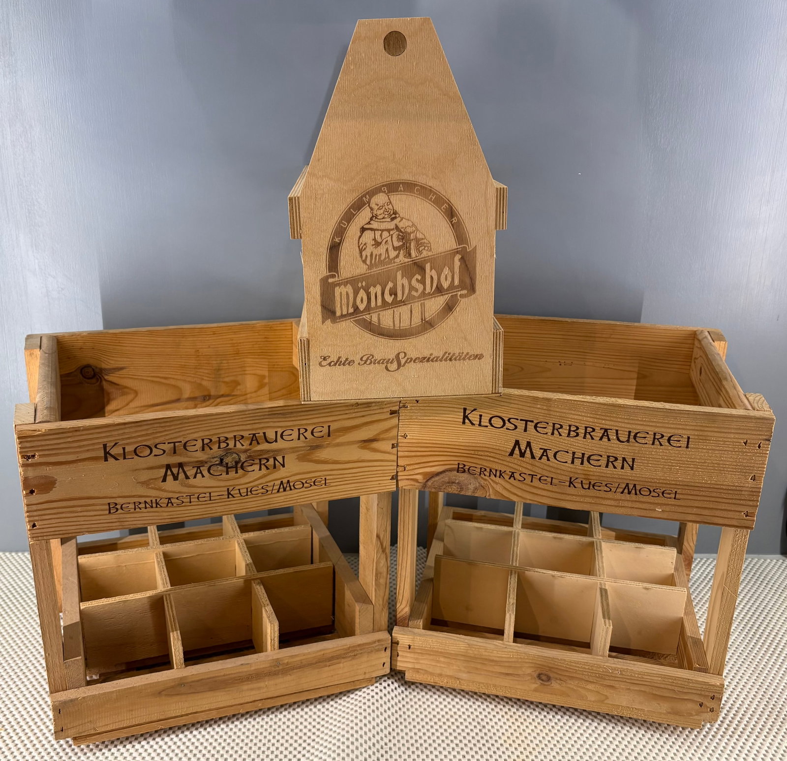 Vtg Trio of (German) Authentic Wooden Beer Crates: A trio of authentic German wooden beer crates. They include....1). Mönchshof Beer Bottle Caddy - This is a branded wooden bottle caddy from the German brewery Mönchshof (Kulmbacher Mönchshof). It f