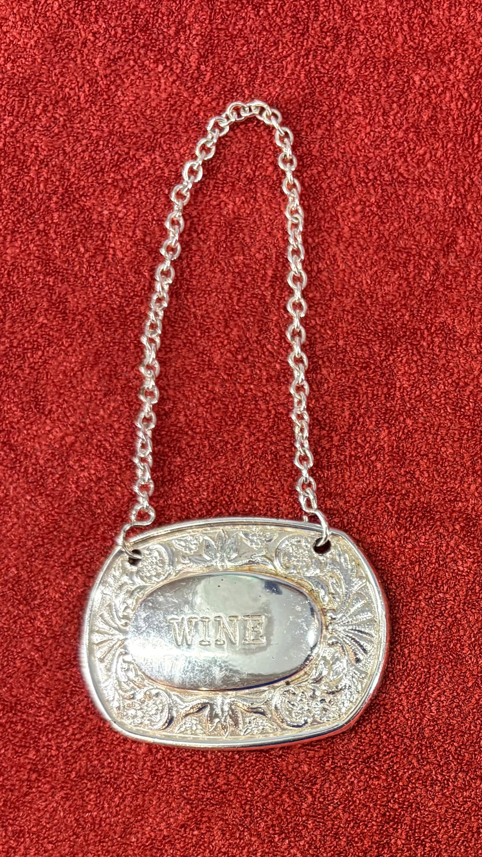 Vtg Silver Plated (British) Decanter Label - Wine: Vintage silver-plated wine decanter label (also called a decanter tag or bottle ticket) manufactured by the English company Ianthe. It features an oval centerpiece embossed with the word "WINE", surro
