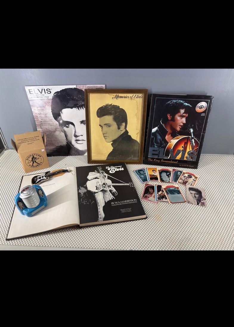 Vtg Elvis Presley Grouping of Memorabilia, Novelty, and Collectibles: A classic assortment of vintage Elvis Presley memorabilia, showcasing books, trading cards, photos, and unique collectible items celebrating "The King of Rock 'n' Roll". The items included are....1). 