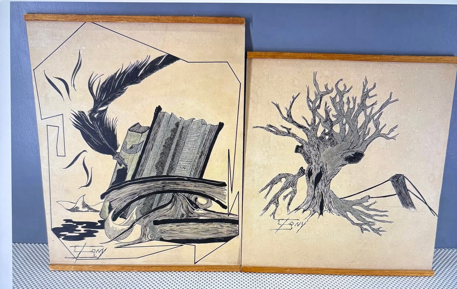 Vintage MCM Surrealist Ink Drawings Presented as Hanging Scrolls: Vintage mid-century modern surrealist ink drawings presented as hanging scrolls or paper prints mounted within wooden top and bottom poster rails, a formatting popular for mid-century illustrative pri