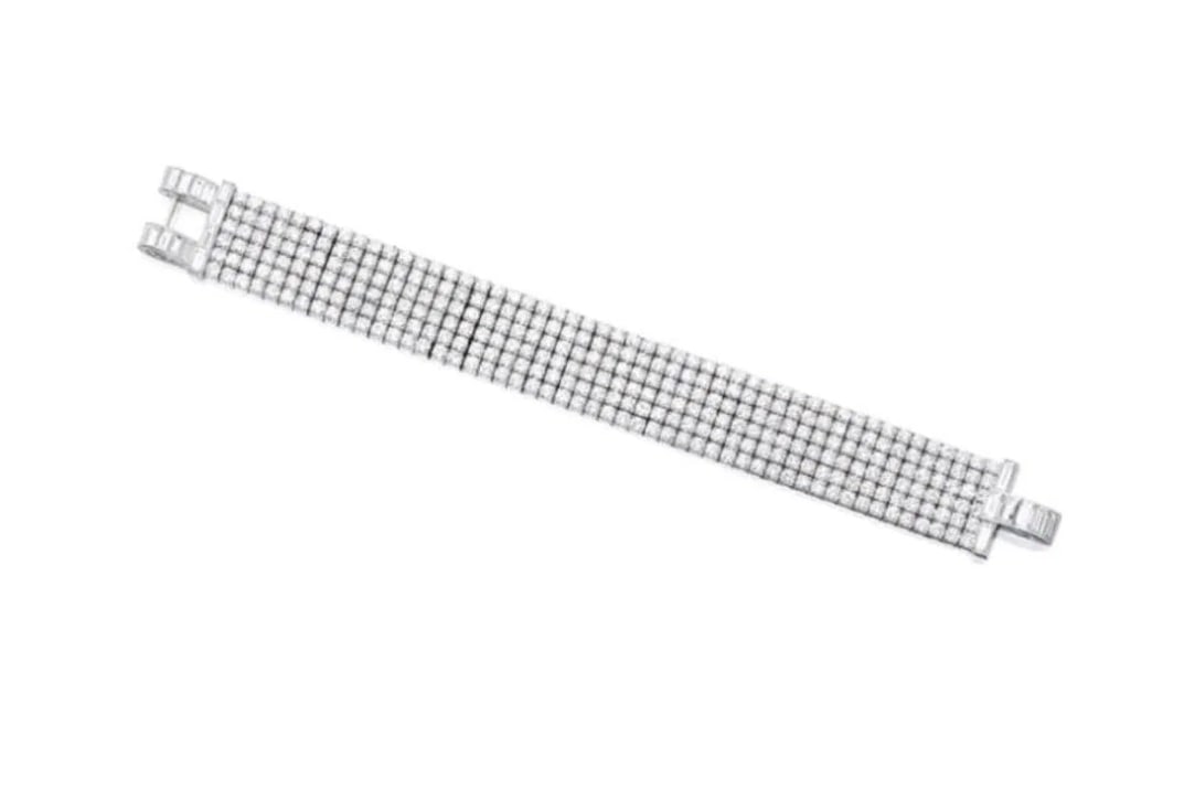 7.5ct Natural Diamond 18Kt Gold Bracelet: Estimate $26,000-$45,00018Kt gold inlaid with natural South African diamonds total weighing 7.5ct, handcrafted into exquisitely beautiful jewelry work, bright fire, shining and dazzling, extremely goo