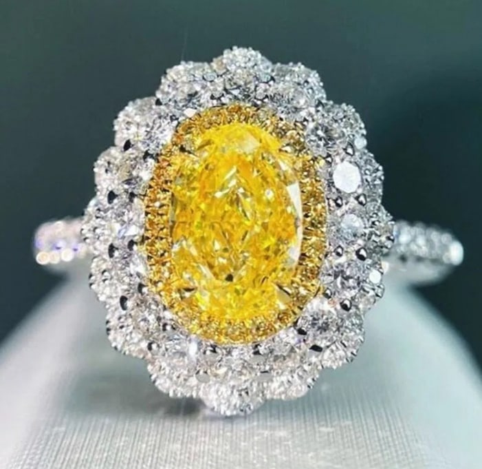1ct Natural Yellow Diamond 18Kt Gold Ring: Estimate $6,500-$10,00018Kt gold inlaid 1.01ct South African natural yellow diamond, matched with 0.78ct natural diamonds, yellow diamond adopts excellent cutting technology to maximize the natural ri