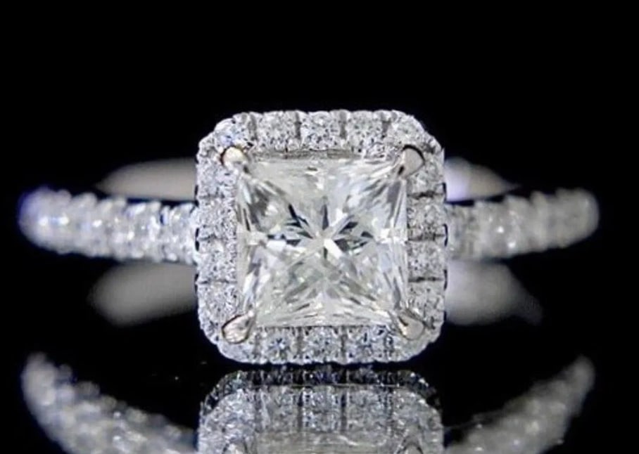 1ct Natural Diamond 18K Gold Ring: Estimate $8,000-$13,50018K gold inlaid with 1ct natural South African high quality diamond, matched with 0.49cts natural diamonds. Crystal clear, good clarity, shining and dazzling, twinkle fire. Shap