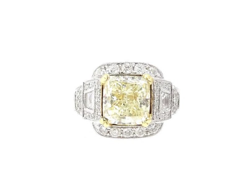 5.01ct Fancy Light Yellow Radiant Cut Diamond: 5.01ct Fancy Light Yellow Radiant Cut DiamondEstimate $30,000-$50,0005.01ct Fancy Light Yellow Radiant Cut Diamond, Set in 18 Karat White Gold Engagement Setting. .85ct. Total Weight 9.6 grams.