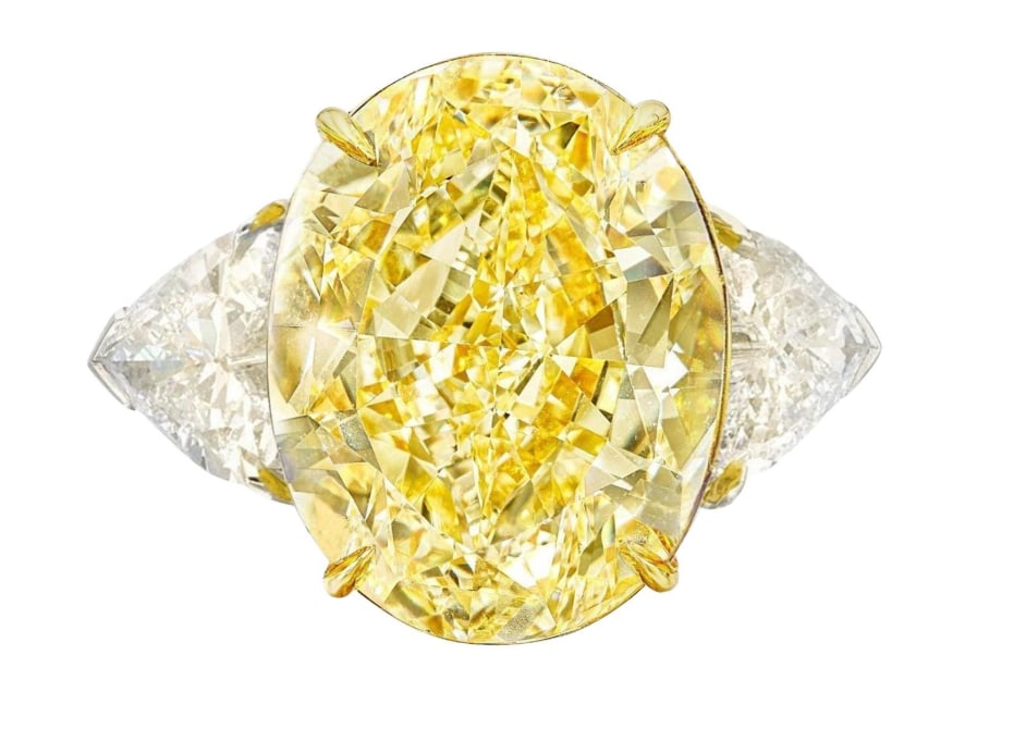 GIA Certified 7.04 Carat Fancy Intense Yellow Diamond Ring (1 of 1)