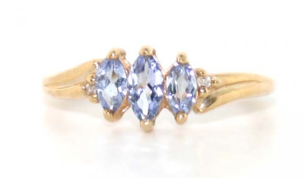 0.60 Ct Diamond and Tanzanite 10Kt Gold Ring: 10 kt yellow gold ring. 1.3 grams of gold. Size 7.