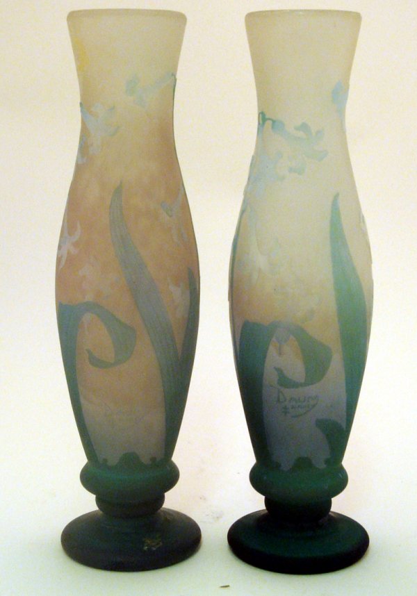 Pair of Daum Nancy Vases Contemporary: Pair of Daum Vases. Vases are white glass with green overlay with etched lilies. Measures 12.5" tall. Contemporary.