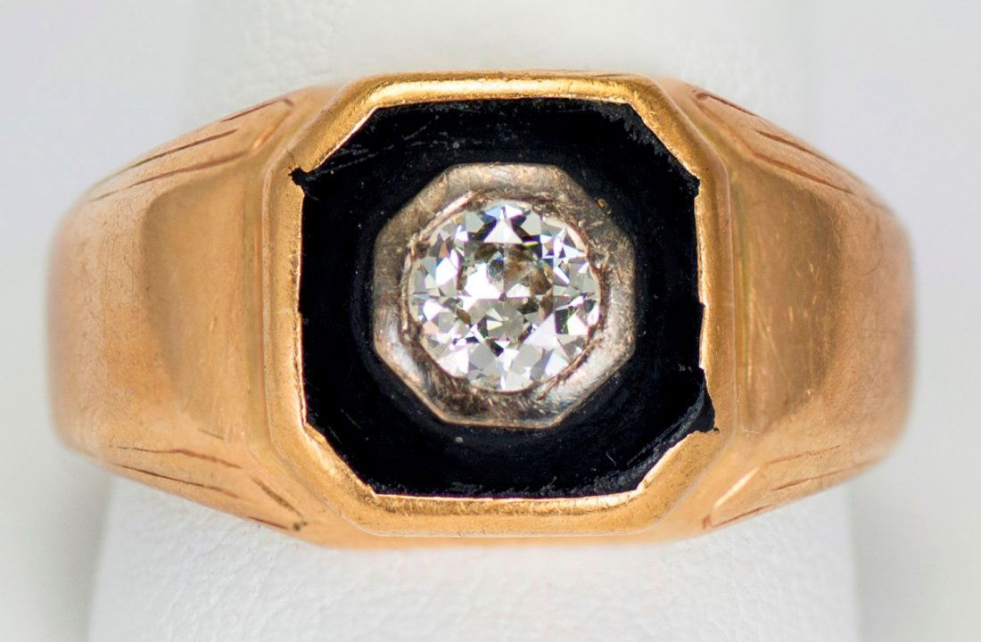 Diamond, Onyx & Gold Ring: Diamond, Onyx & Gold RingCenter stone is .025 ct. Size 6-1/2. Total weight is 8.5 grams.