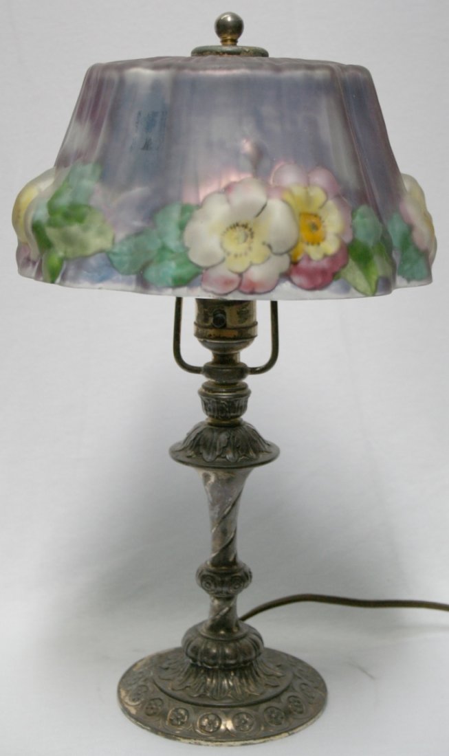 Pairpoint Puffy Boudoir Lamp: Pairpoint Puffy Reverse Painted Floral Boudoir Lamp. 8" shade has lavendar background with yellow and white flowers with green leaves. 14 1/2" H