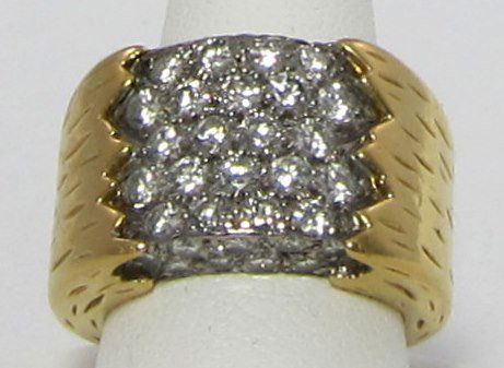 Diamond & 18K Gold Wedding Band: Diamond & 18K Wedding Band. (40) round brilliant diamonds, pave’ set, in a white gold plate. Total carat weight is approximately 1.82 Ct. Average clarity grade is VS2-SI2. Average color grade is F-H
