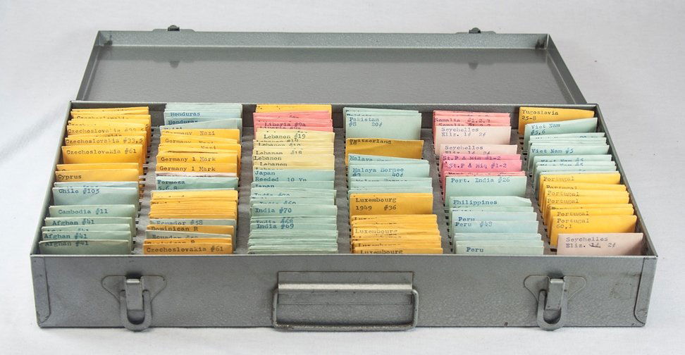 Neat Old-Time Box with Foreign Coins: This neat old-time coin storage box includes dozens of foreign coins. We only opened a few of the envelopes to photograph, but we can tell by feel that each envelope contains at least one coin, with s