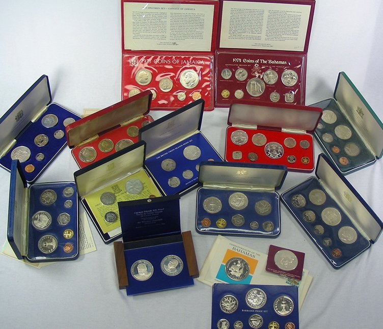Large Group of 15 Caribbean Silver Coin Sets: There is a lot of silver in this lot! We didn't take the time to calculate the actual silver weight, but to be very conservative, there is easily over twenty ounce of pure silver in the lot. All of th