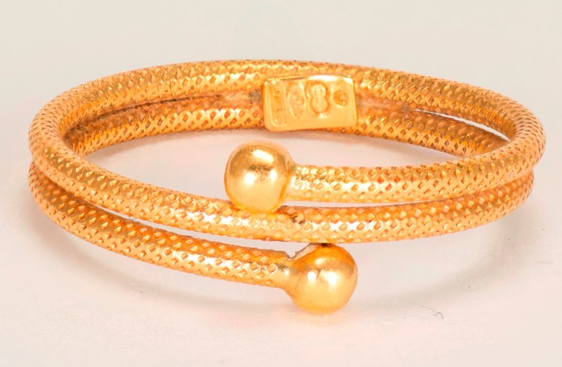 Rope Design 14K Double Gold Band: 14K double gold band resembling a rope design with two gold balls on the ends of the band. Ring size is 9 and total ring weight is 0.07 troy ounces.