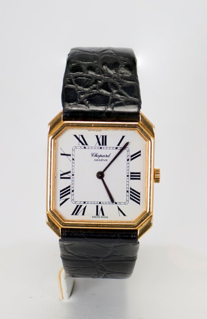 18K Gold Chopard Watch: 18K gold L.U. Chopard Geneve watch. The length is 8.75 Inches and the weight of gold case is 0.50 troy ounces. The watch is operated by hand-winding. Comes with original carrying case.