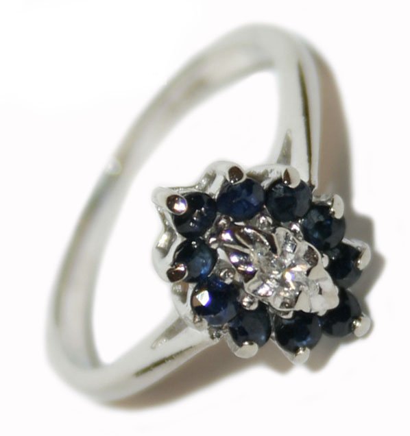 10k White Gold 0.50 ct Diamond & Sapphire Ring (3525): Weighing 2 Grams It Contains Ten Round Shape Dark Blue Sapphire 0.40 ct And A Marquise Shape 4x2 mm Diamond 0.10 ct Weight SI Clarity Mounted All In Prong Setting, The Ring Measures 0.4" Width And Its