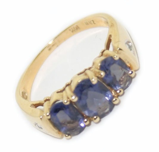 14k Yellow Gold Diamond & Iolite Ring 3.35 Grams Size 6: 14k yellow gold diamond and iolite ring with a total weight of 3.35 grams , it contains 2 small round shaped diamonds and 3 oval shaped iolites 2ct in weight, the ring is a size 6 �