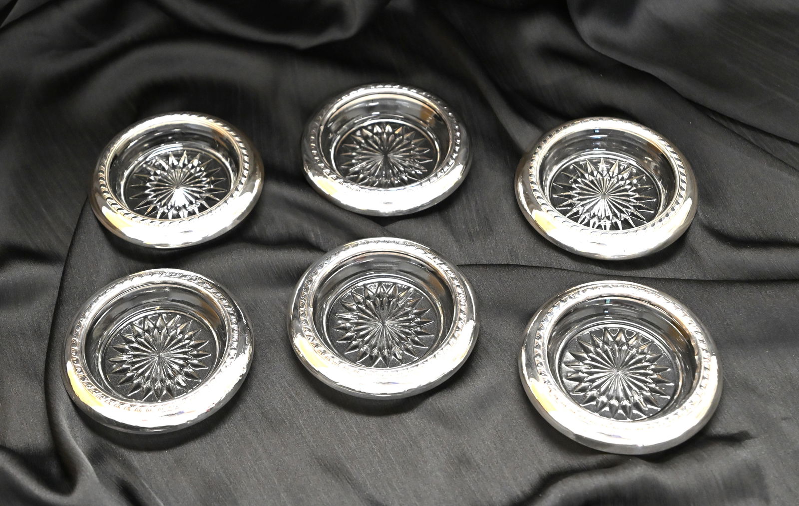Set of 6 Sterling Silver & Glass Coasters: Elevate your entertaining with this authentic set of six vintage coasters, marked sterling silver. Each coaster features a polished sterling silver rim with a lovely textured pattern, paired with a pr