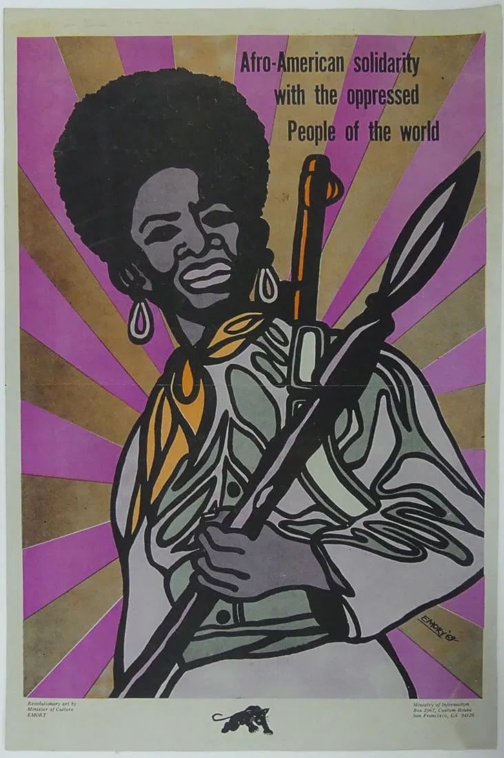 EMORY DOUGLAS 'AFRO-AMERICAN SOLIDARITY' POSTER: Emory Douglas Afro-American Solidarity with the Oppressed People of the World Poster. African-American female holding a spear.Print date unknown. Sheet measures 22 1/2" x 14 3/4" inches, unknown print