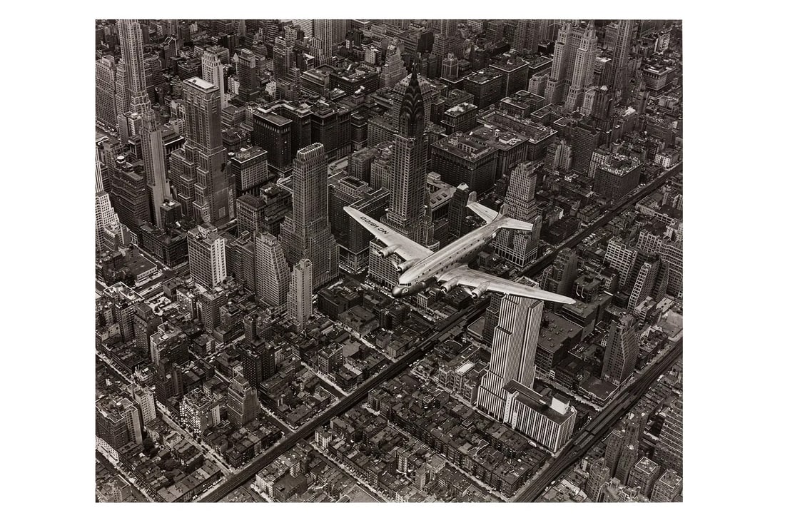 Margaret Bourke-White (1904-1971): Margaret Bourke-White (1904-1971) A DC4 FLYING OVER NEW YORK CITY, 1939. Photo print, printed later, measures size 16 x 20 inches