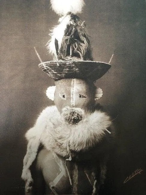 Edward Curtis - Basket Cap Master, 1904: EDWARD CURTIS (B.1868-1952), Basket Cap Master (Zahadolzha) - Yebichai, Navajo, 1904, Photo-Litho, 8.5" x 6", Printed second half of 20th Century, mounted to archival board
