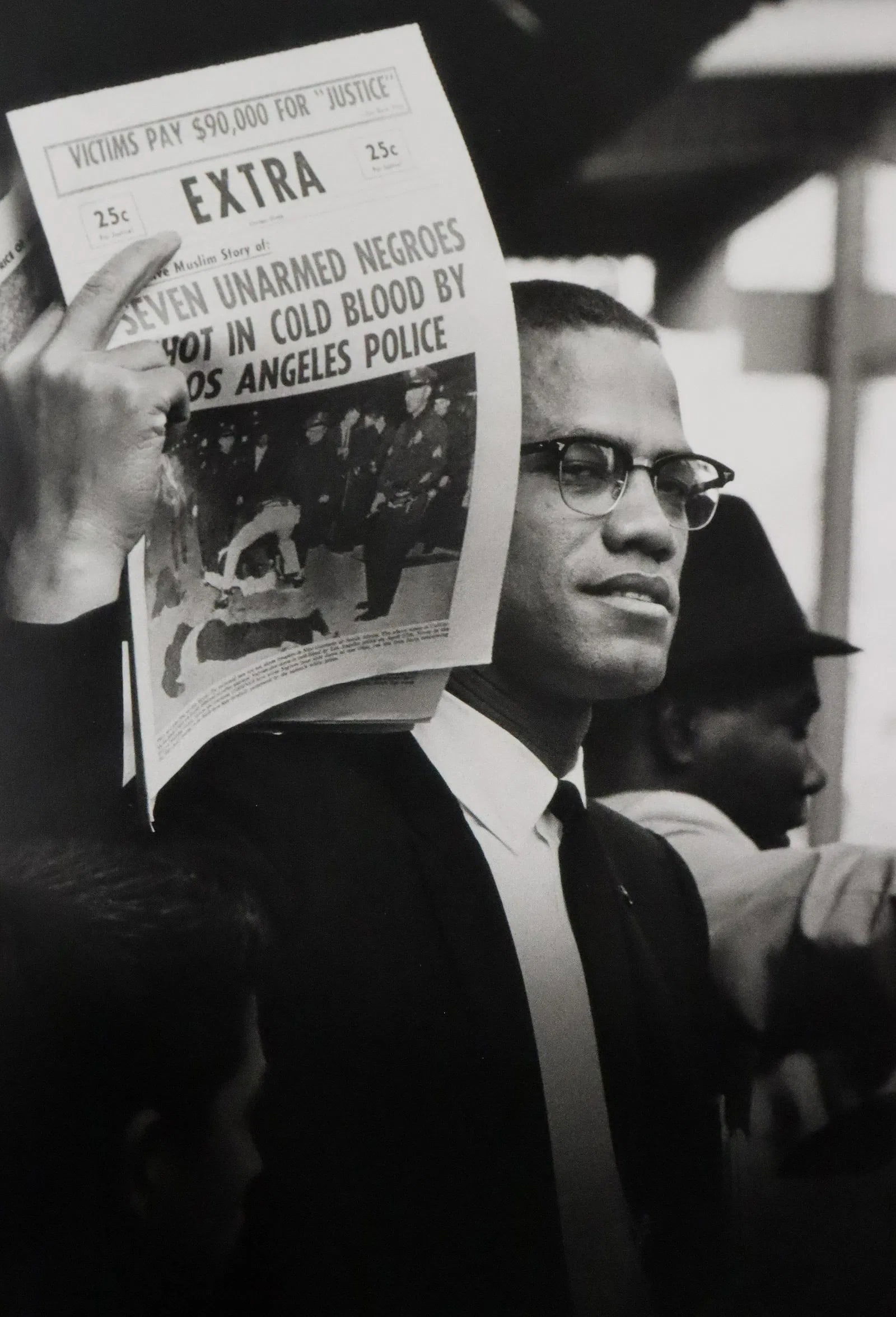 Gordon Parks - Malcolm X, Muslim Newspaper, Photo-Litho: GORDON PARKS (1912-2006), Malcolm X Holding Up Black Muslim Newspaper, Chicago, Illinois, Photo-litho, Printed circa later 20th century, 8 3/4" x 6", mounted to archival board