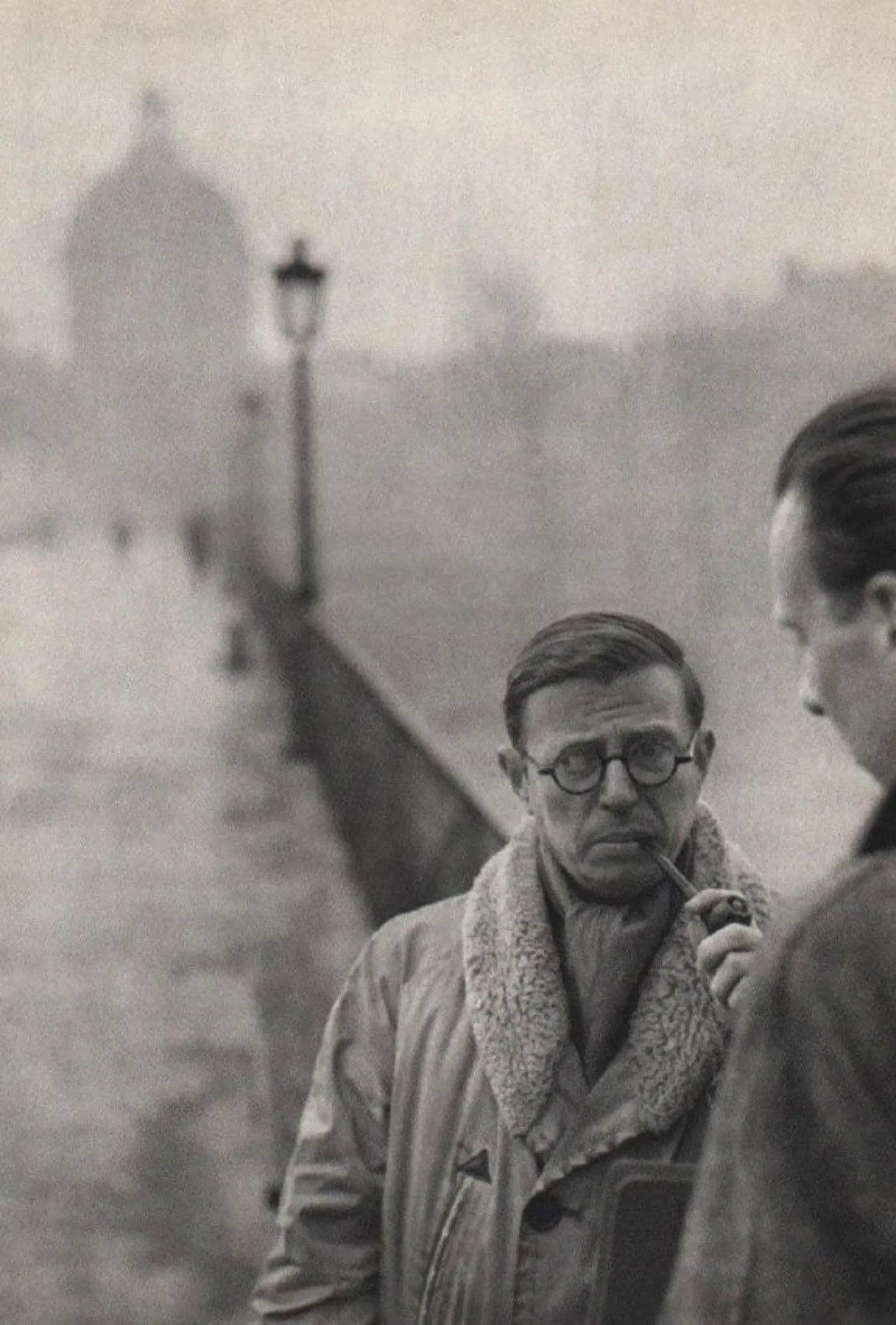 Henri Cartier-Bresson - Jean-Paul Sartre: HENRI CARTIER-BRESSON (1908-2004), Jean-Paul Sartre on the Pont des Arts,, Paris,1946, Sheet-fed Gravure,1952, Printed in France,13" x 9", mounted to archival board