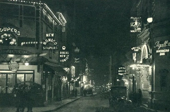 Krull, Germaine - Place Pigalle: Vintage Sheet-fed Gravure. A modernist urban scene by the avant-garde French-German photographer. Image size: approx. 7" x 9"., Mounted to archival board