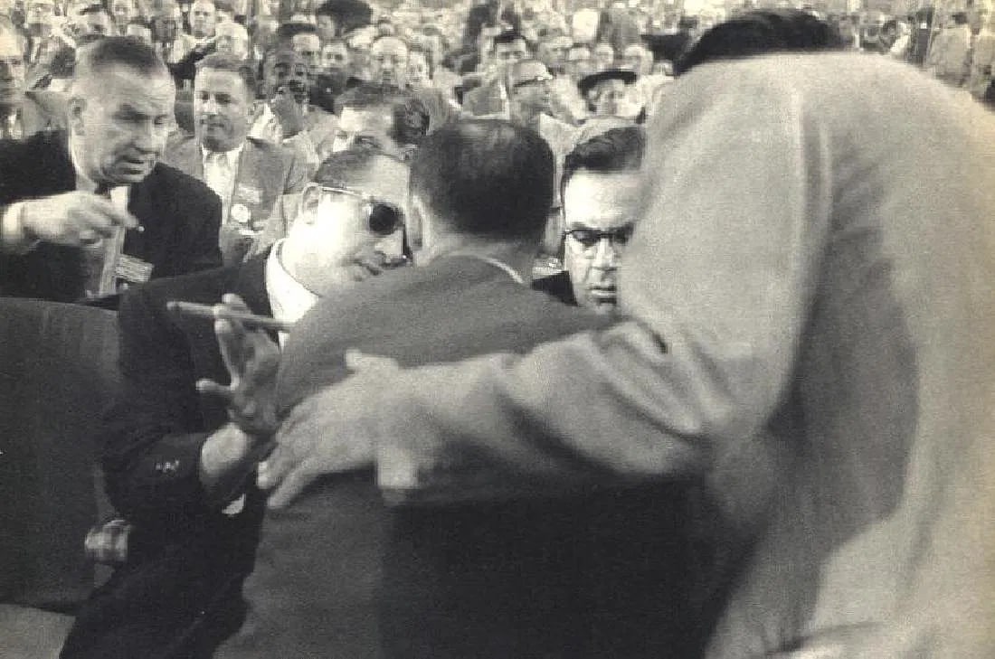 Frank, Robert - Convention Hall, Chicago: Vintage Sheet-fed Gravure. A cynical and powerful view from "The Americans." Image size: approx. 7.5" x 11.5"., Mounted to archival board