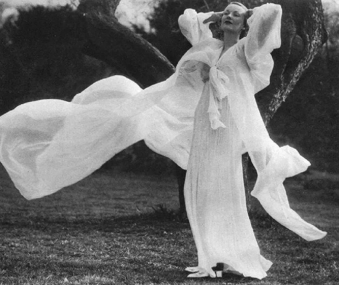 Martin Munkacsi - Peignoir In Soft Breeze: Vintage Sheet-fed Gravure. Fashion study focused on movement. Image size: approx. 8.5" x 11.5"., Mounted to archival board