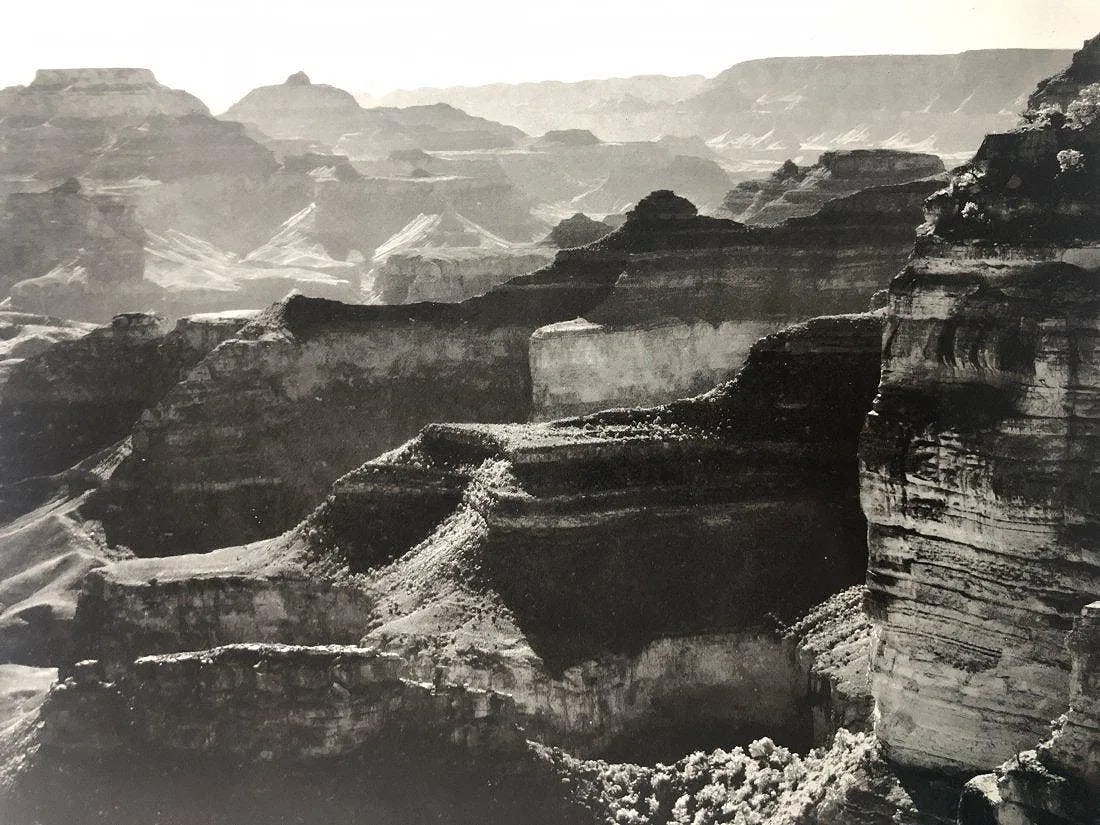 Ansel Adams - Grand Canyon National Park Arizona: ANSEL ADAMS (B.1902-1984), The Grand Canyon from the South Rim, Grand Canyon National Park, Arizona, Black and white photo on glossy paper, 7.5" x 9.5", Printed second half of 20th Century, Mounted to