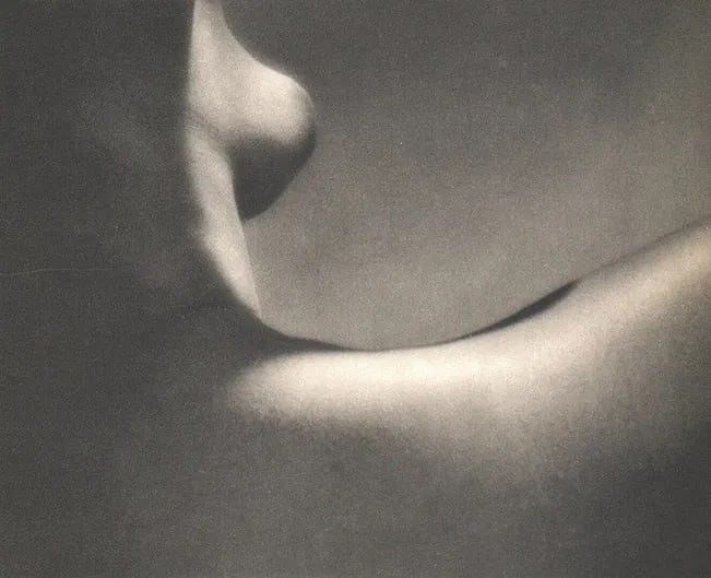 Munkacsi, Martin - Nude Breast: Vintage Sheet-fed Gravure. Abstracted fragment study using graphic light. Image size: approx. 9" x 12"., Mounted to archival board