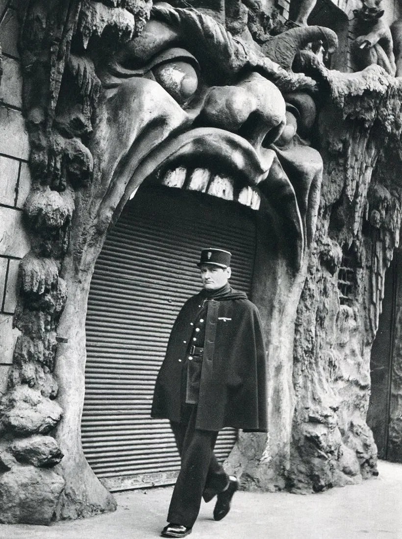 Doisneau, Robert - Hell, 1952: Vintage Sheet-fed Gravure. Whimsical Parisian street study. Image size: approx. 8.5" x 11"., Mounted to archival board
