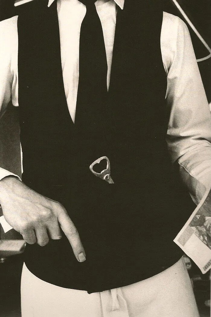 Ralph Gibson - Garcon: Vintage Sheet-fed Gravure. High-contrast, minimalist study of light and shadow on a server in Paris. Image size: approx. 8" x 12"., Mounted to archival board