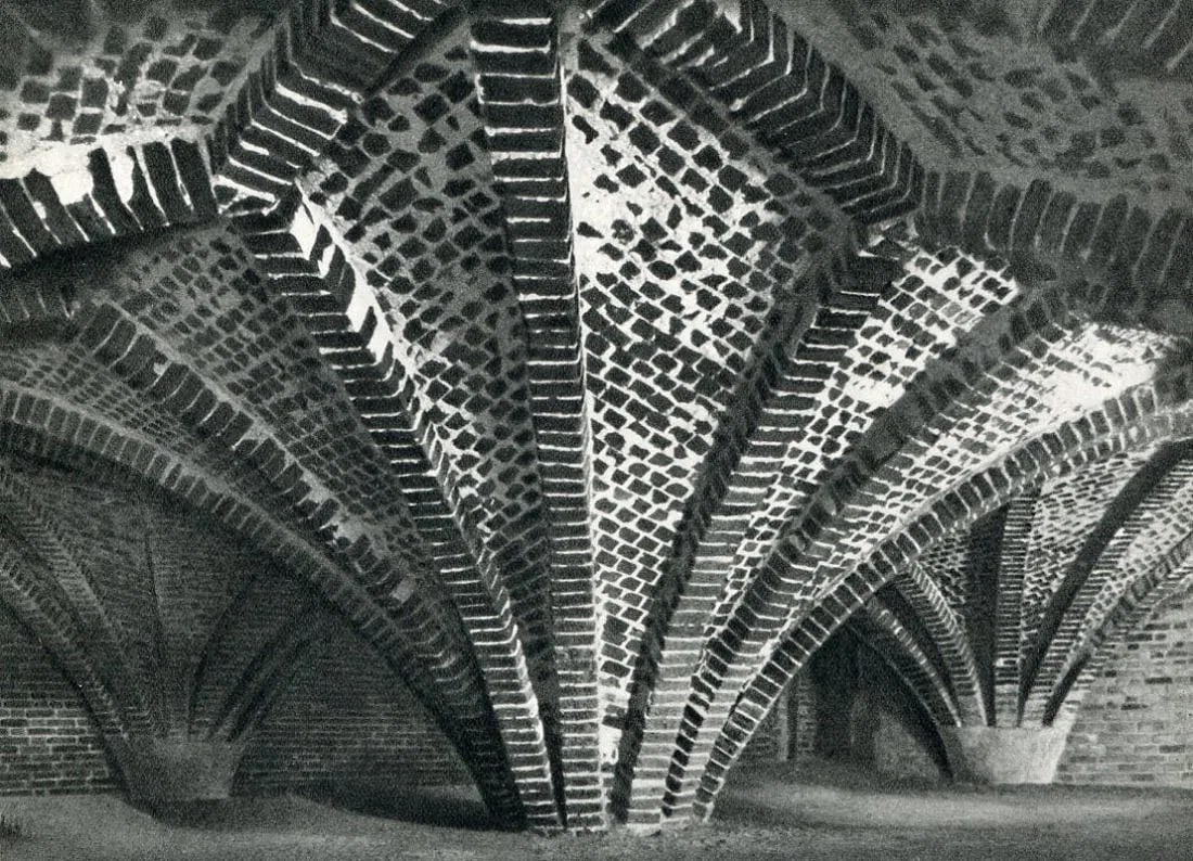 Kuhn, Fritz - Vaults Of A Castle: Vintage Sheet-fed Gravure. A dramatic architectural study of historic stonework and shadow. Image size: approx. 8" x 11"., Mounted to archival board