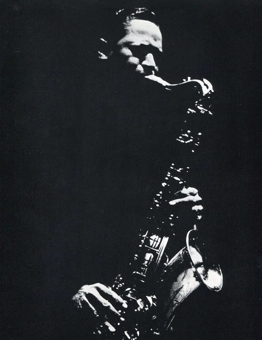 Stock, Dennis - Illinois Jacquet: Vintage Sheet-fed Gravure. A candid, smoky jazz portrait of the legendary saxophonist. Image size: approx. 8" x 10.5"., Mounted to archival board