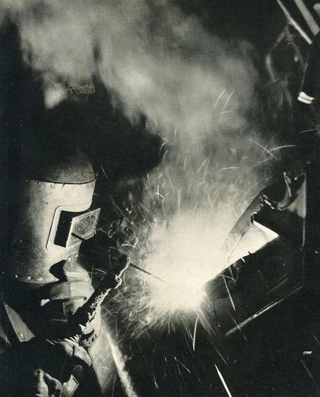 Sarra, Valentino - The Welder: Vintage Sheet-fed Gravure. Dramatic industrial photography from the "Age of Steel." Image size: approx. 8.5" x 11"., Mounted to archival board