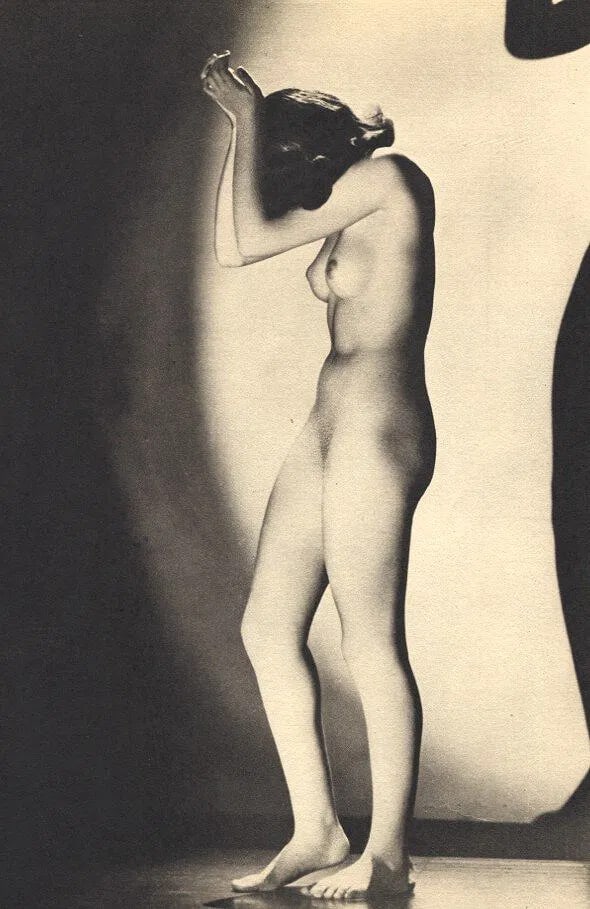 De Bellis, Joseph - Nude: Vintage Sheet-fed Gravure. A sophisticated studio study with dramatic lighting. Image size: approx. 8" x 10.5"., Mounted to archival board