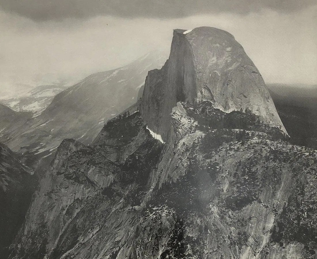 Ansel Adams - Half Dome, Glacier Point, Thunderstorm: ANSEL ADAMS (B.1902-1984), Half Dome, Glacier Point, Thunderstorm, Black and white photo on glossy paper, 7 1/2" x 9", Printed second half of 20th Century , Mounted to archival board