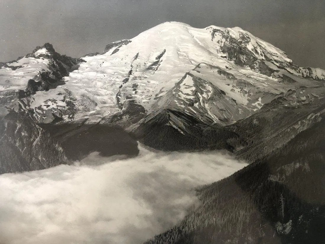 Ansel Adams - Mount Rainier National Park, Washington: ANSEL ADAMS (B.1902-1984), Mount Rainier, Sunrise, from Yakima Park, Mount Rainier National Park, Washington, Black and white photo on glossy paper, 7 1/4" x 9 1/2", Printed second half of 20th