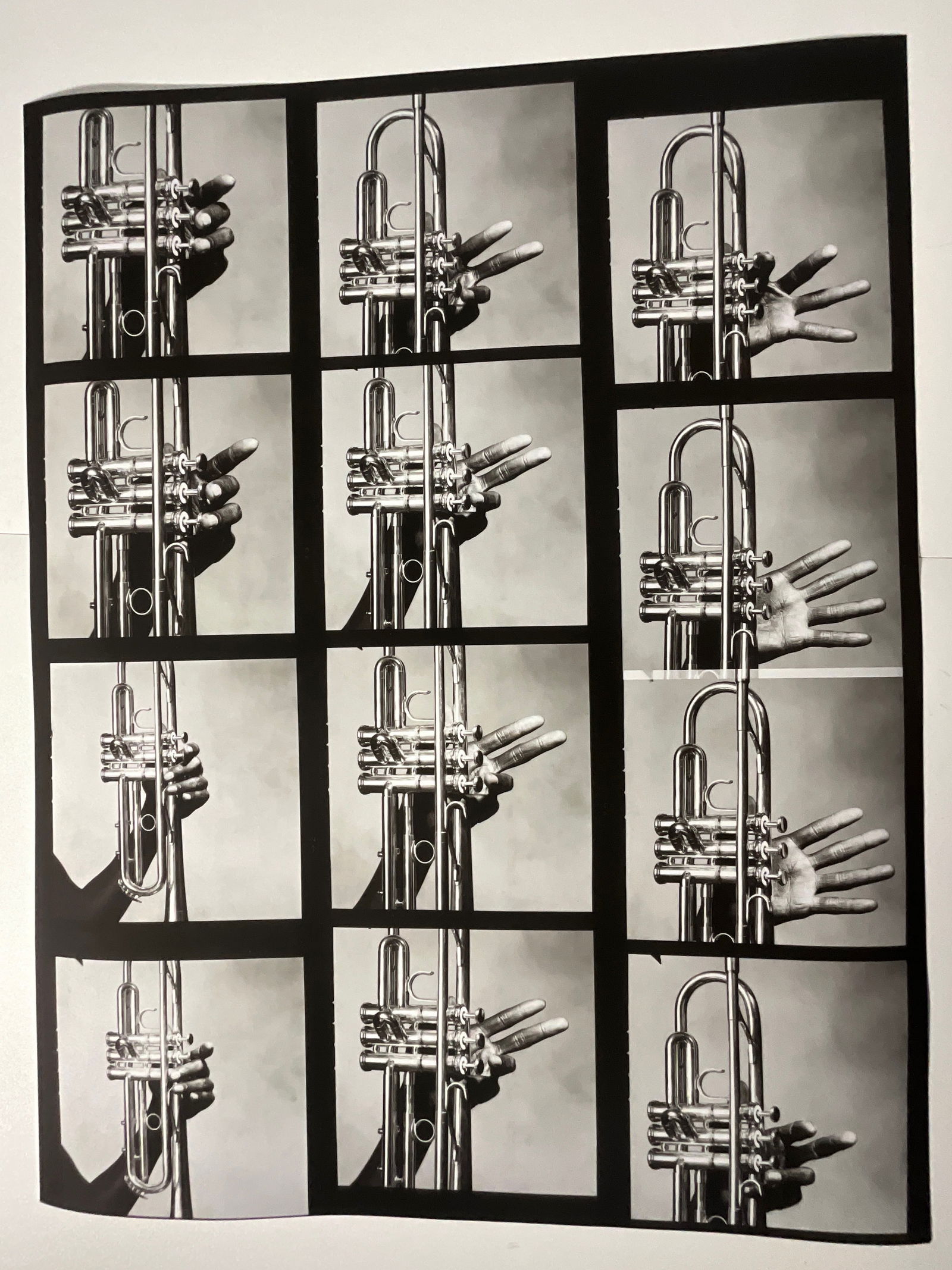 Miles Davis: 12 Hands: 12 Hands of Miles Davis and His Trumpet, New York; Print on woven paper, measures 31 x 40 inches.