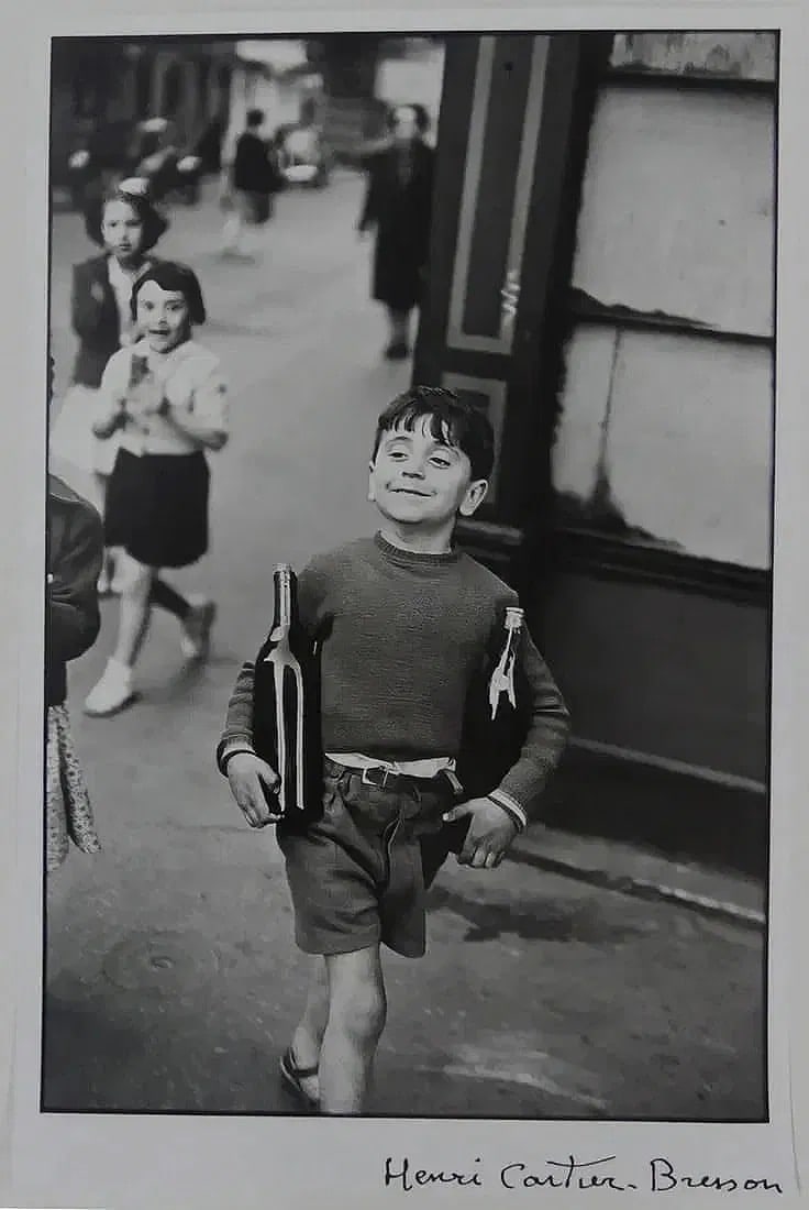 Henri Cartier-Bresson: Rue Mouffetard: Signed in the plate lower right. Sheet measures 22 x 14 inches, print on rag paper.