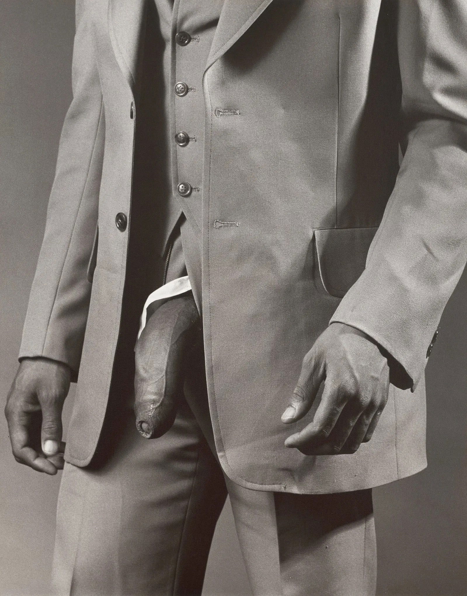 ROBERT MAPPLETHORPE (1946-1989) Man in Polyester Suit, 1980: measures 20 x 16 inches, glossy photo print, printed later, mounted to foam board