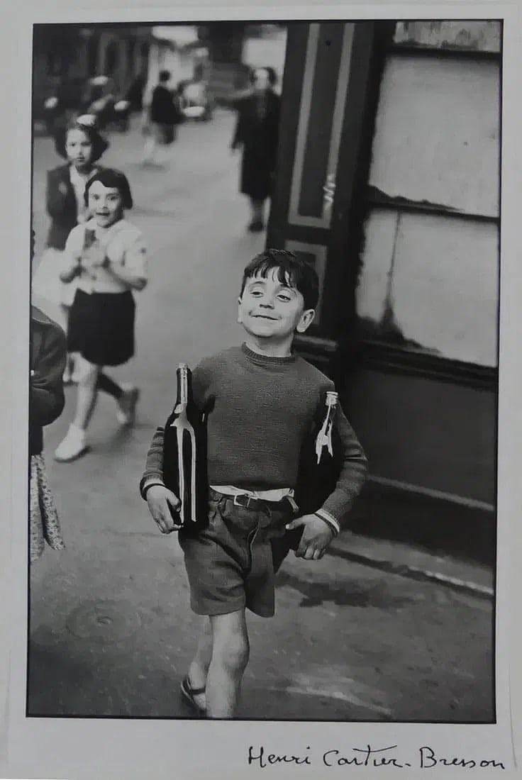 HENRI CARTIER-BRESSON 'RUE MOUFFETARD' PHOTO-LITHO: Henri Cartier-Bresson Rue Mouffetard photo litho. Signed in the plate lower right. Sheet measures 22 x 14 inches