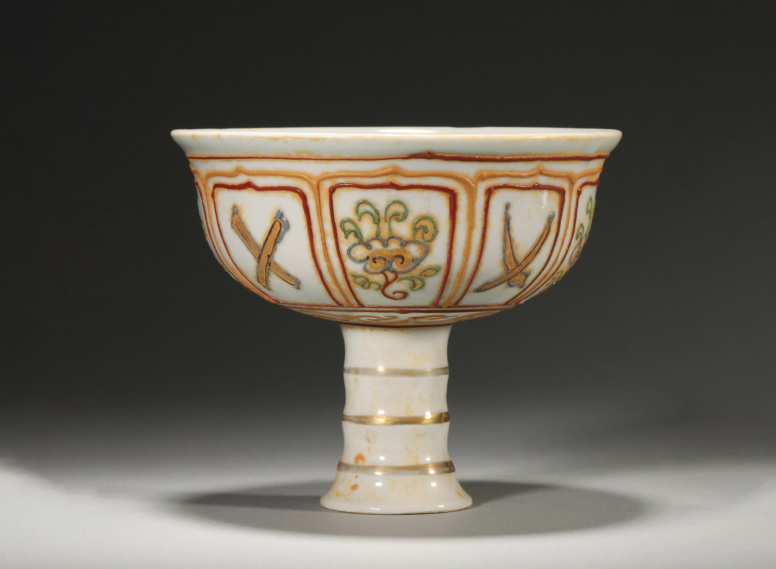 TANG DYNASTY PASTE-TRACED AND GILDED STEM CUP WITH AUSPICIOUS PATTERN: Diameter 13cm, Height 10.5cm