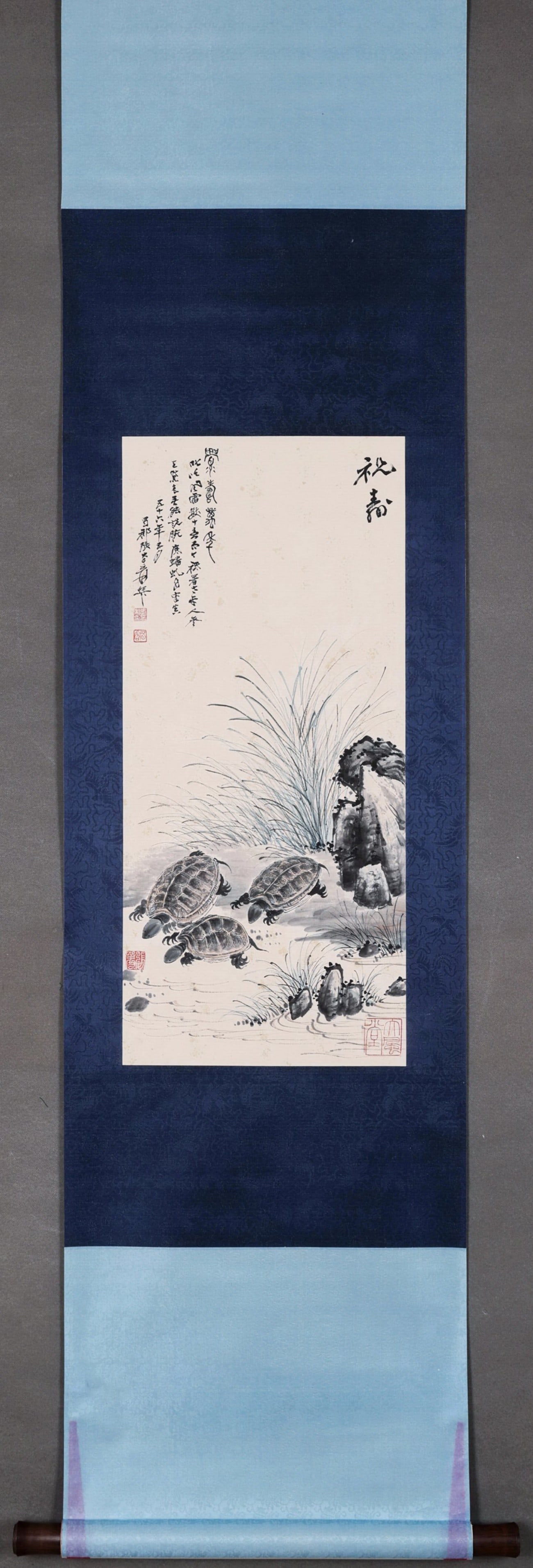 A Hanging Scroll "Birthday Blessing with Turtles" by Zhang Daqian: Painting Core SizeL 69cm (27.17 in); W 30cm (11.81 in)A hanging scroll by Zhang Daqian, depicting three turtles by the stream in ink wash with auspicious birthday themes. With delicate details and ele